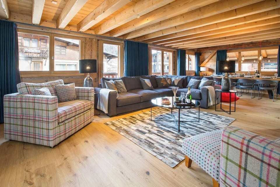 Open plan living with doors to balcony