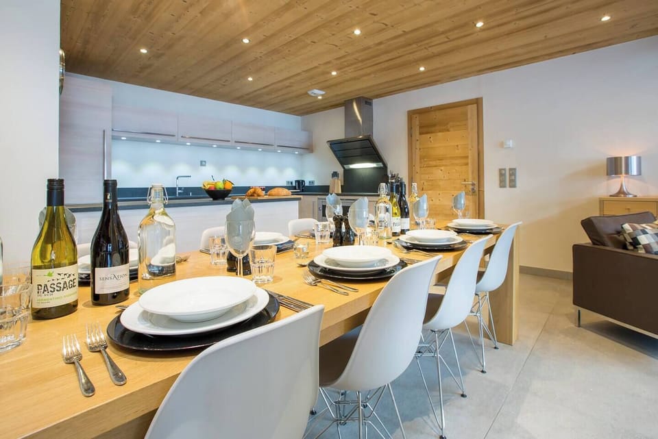 Large Open Plan kitchen with breakfast bar and seperate dining space next to the fireplace.