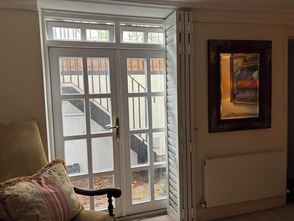 French doors to front of apartment