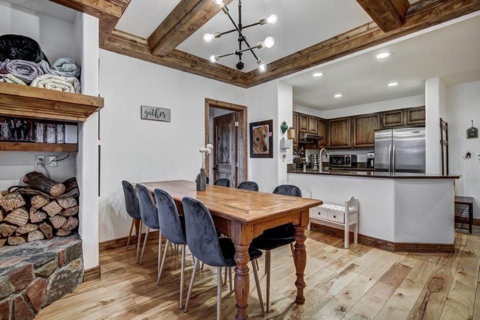 Gather around the dining table for shared meals and easy conversation, with rustic beams overhead and the warmth of mountain style all around.