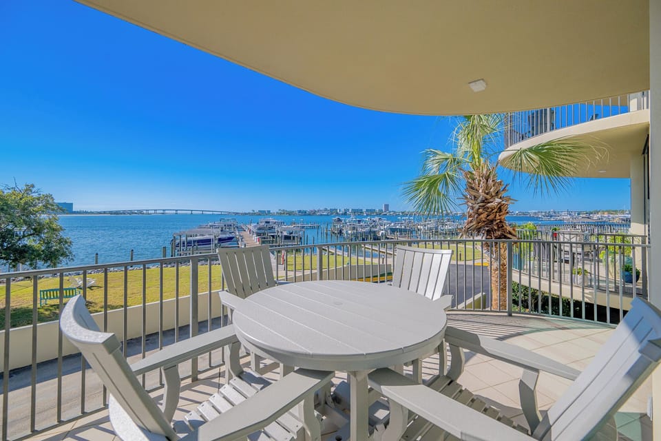 Revel in the coastal breeze from the spacious balcony while soaking in the enchanting views of the bay and marina