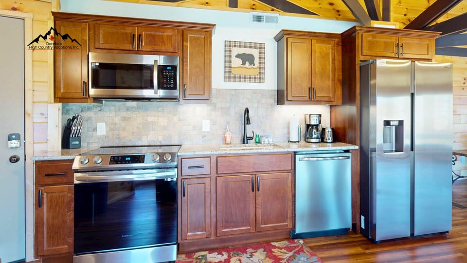 This updated kitchen features modern appliances, ample prep space, and everything you need for easy meals after a day on the mountain.