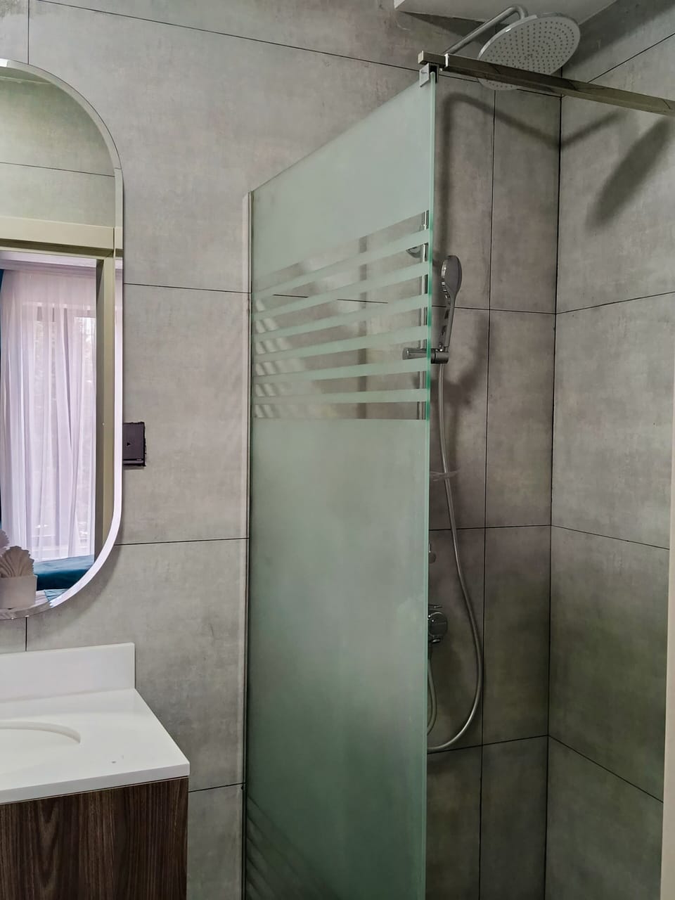 Separate tub and shower, hair dryer, slippers, towels