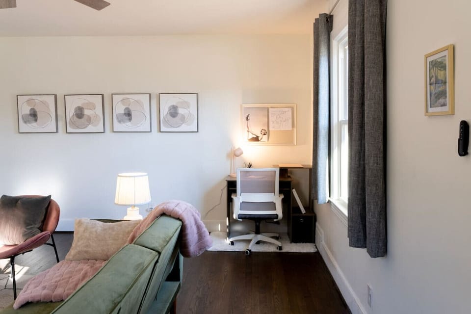 As you walk through the front door, you`re in the living room and to your right is the desk.