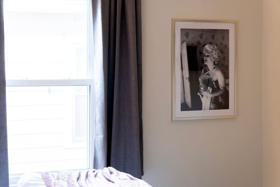 In the first bedroom you`ll feel like Marilyn`s getting ready next to you.