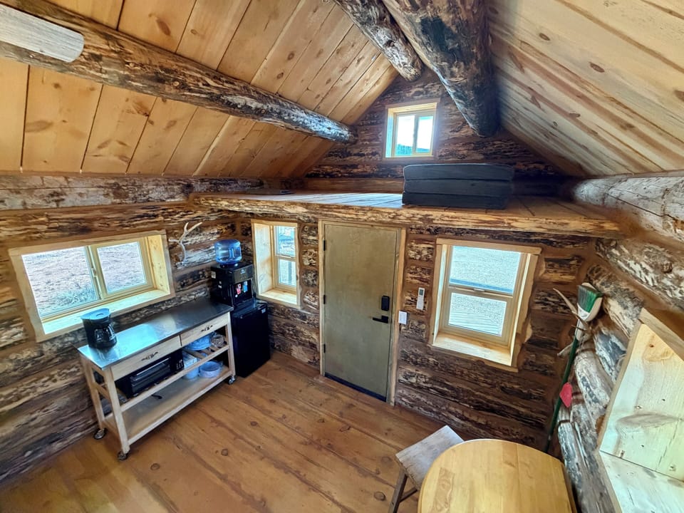Loft, Kitchenette, Small Fridge, Water, Table.