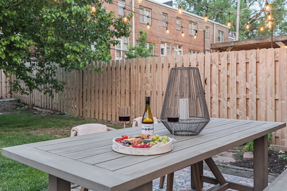 Relax on the patio with wine, a charcuterie board, and cozy string lights.