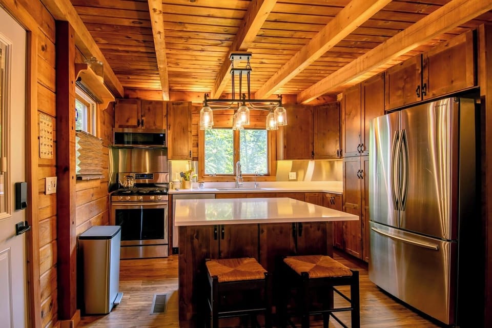 Kitchen with quartz counters, island with breakfast bar, stainless backsplash, reverse osmosis, spices and ample kitchen supplies. Ask host if you want to make sure the kitchen is quipped with what you need.