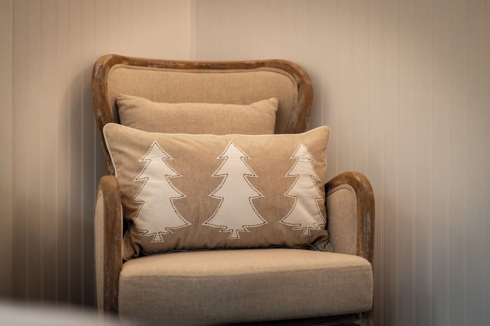 Settle into this chair with a warm drink, wrapped in a blanket, as the hush of the mountains fills your morning.