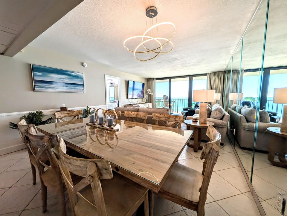 Spacious dining and living area with panoramic city views