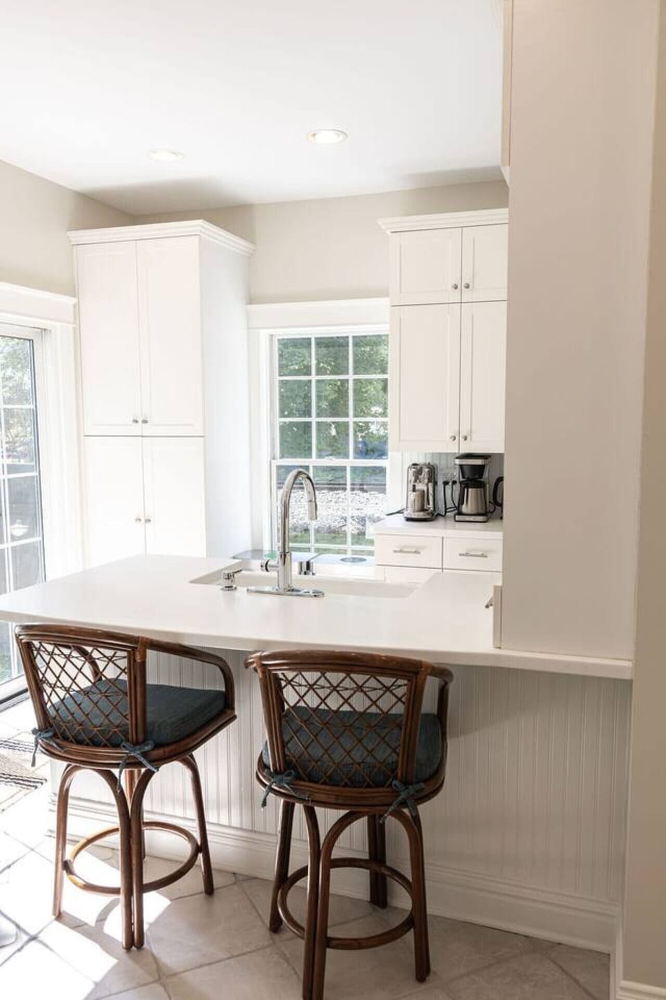 Seating for 2 at the counter in the bright and modern kitchen.