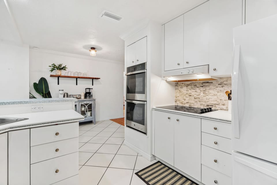 Enjoy cooking on the stovetop, baking in the oven, and making coffee at the coffee station!
