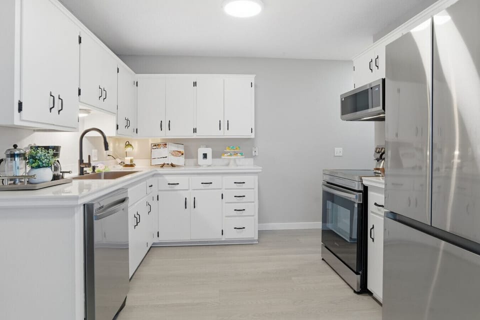 Kitchen |Bright White Cabinets with Stainless Steel Appliances and Modern Finishes