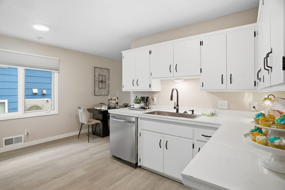 Kitchen | Bright White Cabinets with Stainless Steel Appliances and Modern Finishes