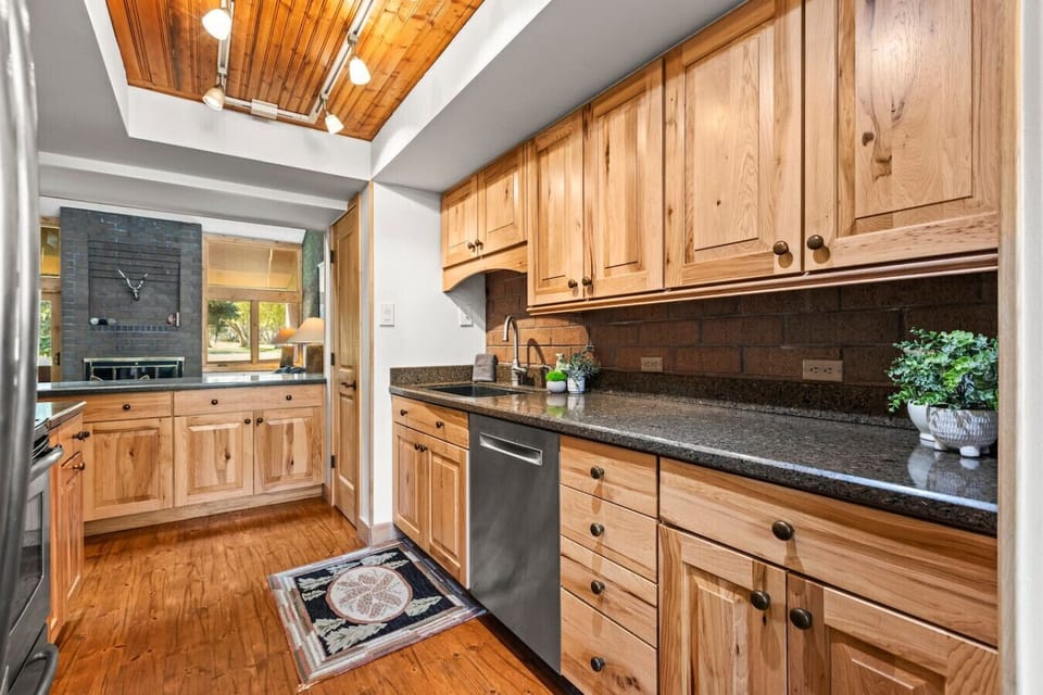 Fully stocked kitchen with nice views of the golf course and nordic ski track