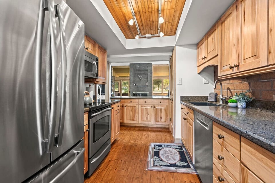Fully stocked kitchen with an open concept layout so you don`t miss a thing if it is your night in the kitchen