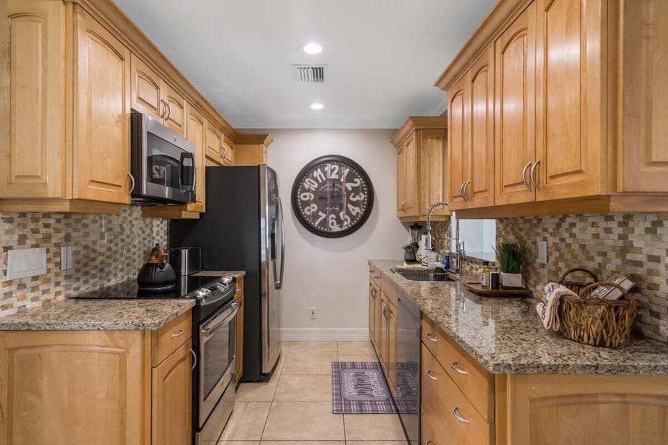 Beautiful, clean appliances and spacious countertops for cooking.