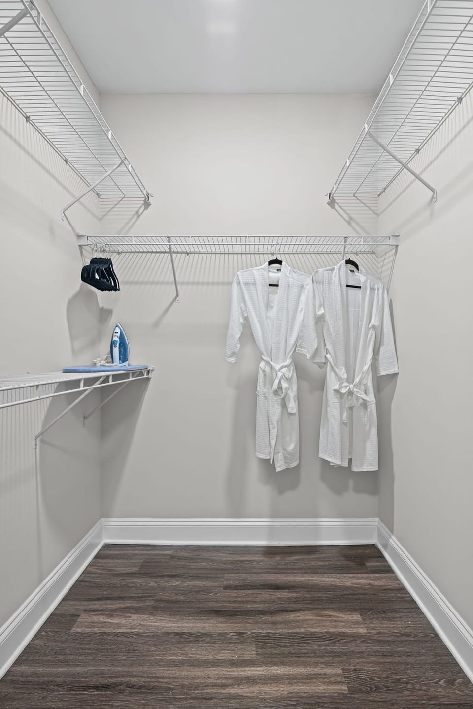 Slip into your robe & unwind — two plush robes, iron & ironing board included