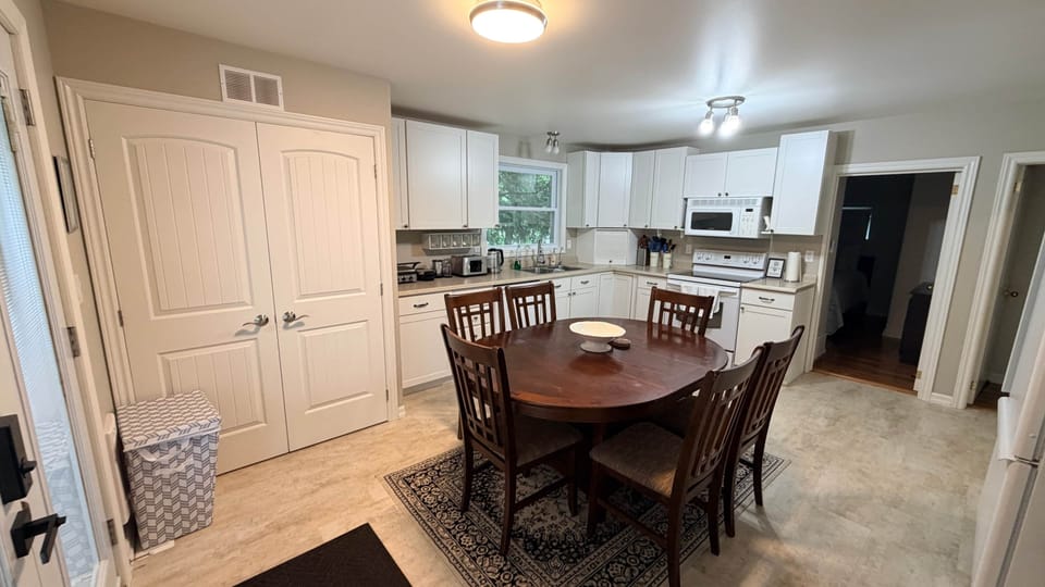 Modern kitchen setup with toaster, griddle, blender, dishwasher, and everything you need for cooking