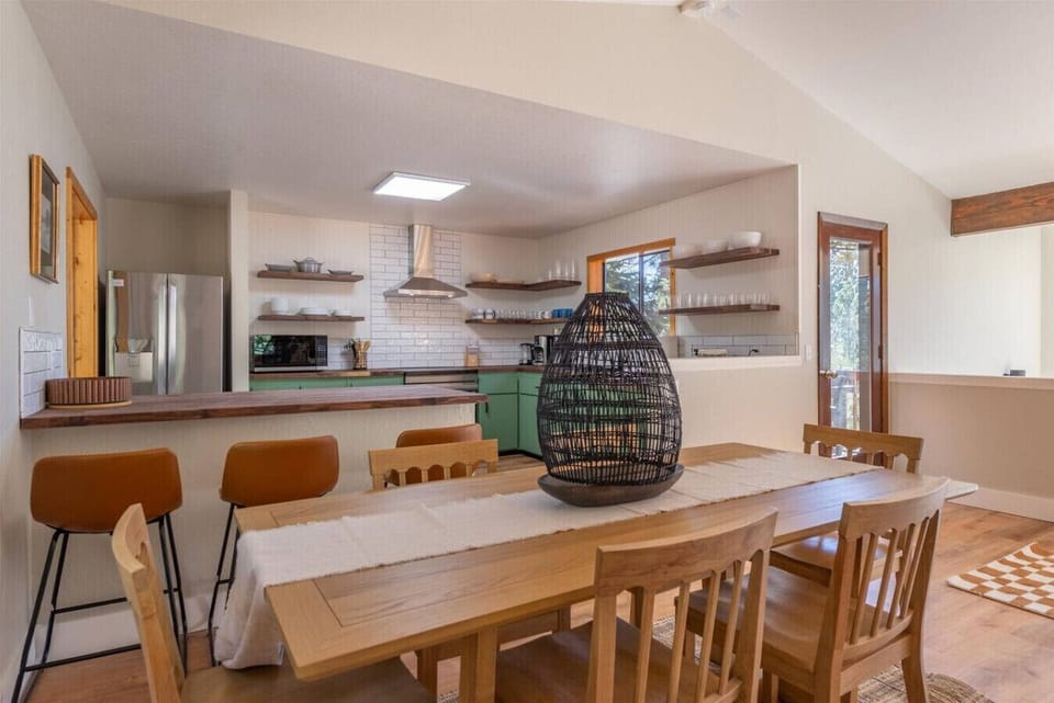 Dining Area with Table to Seat 6 along with Additional Bar Seating