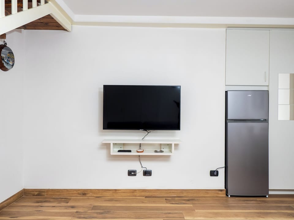 Standard Apartment | Living area | 46-inch Smart TV with digital channels