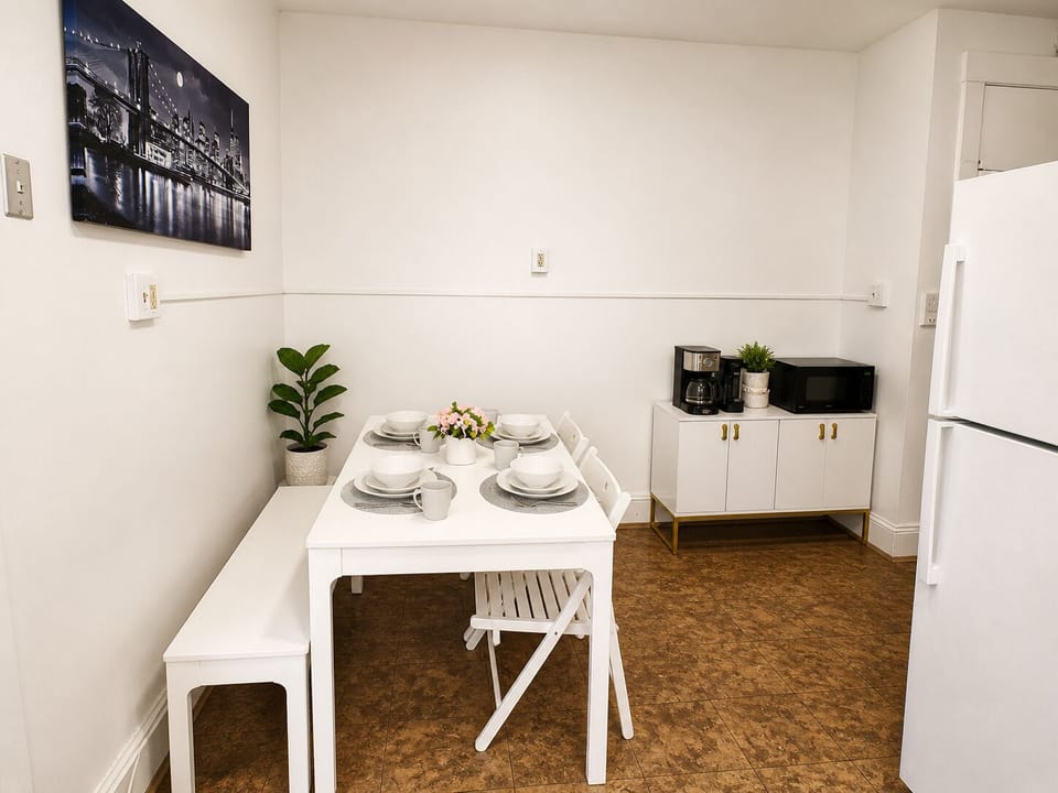 Bright dining nook with coffee station, microwave, seating for four