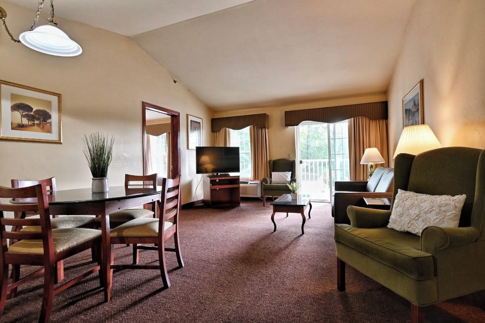 Gather for movies and meals in this airy suite lounge.