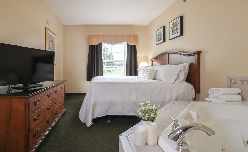 Settle into a crisp king bed beside spa-style soaking.