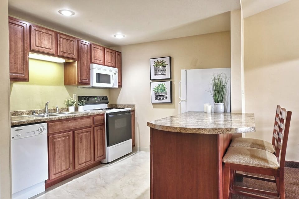 Cook easy meals in the full kitchen with breakfast bar.