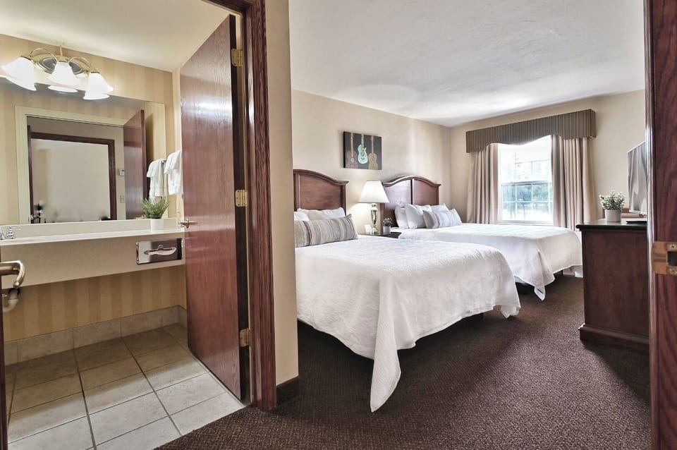 Settle in fast with crisp linens and a restful setup.