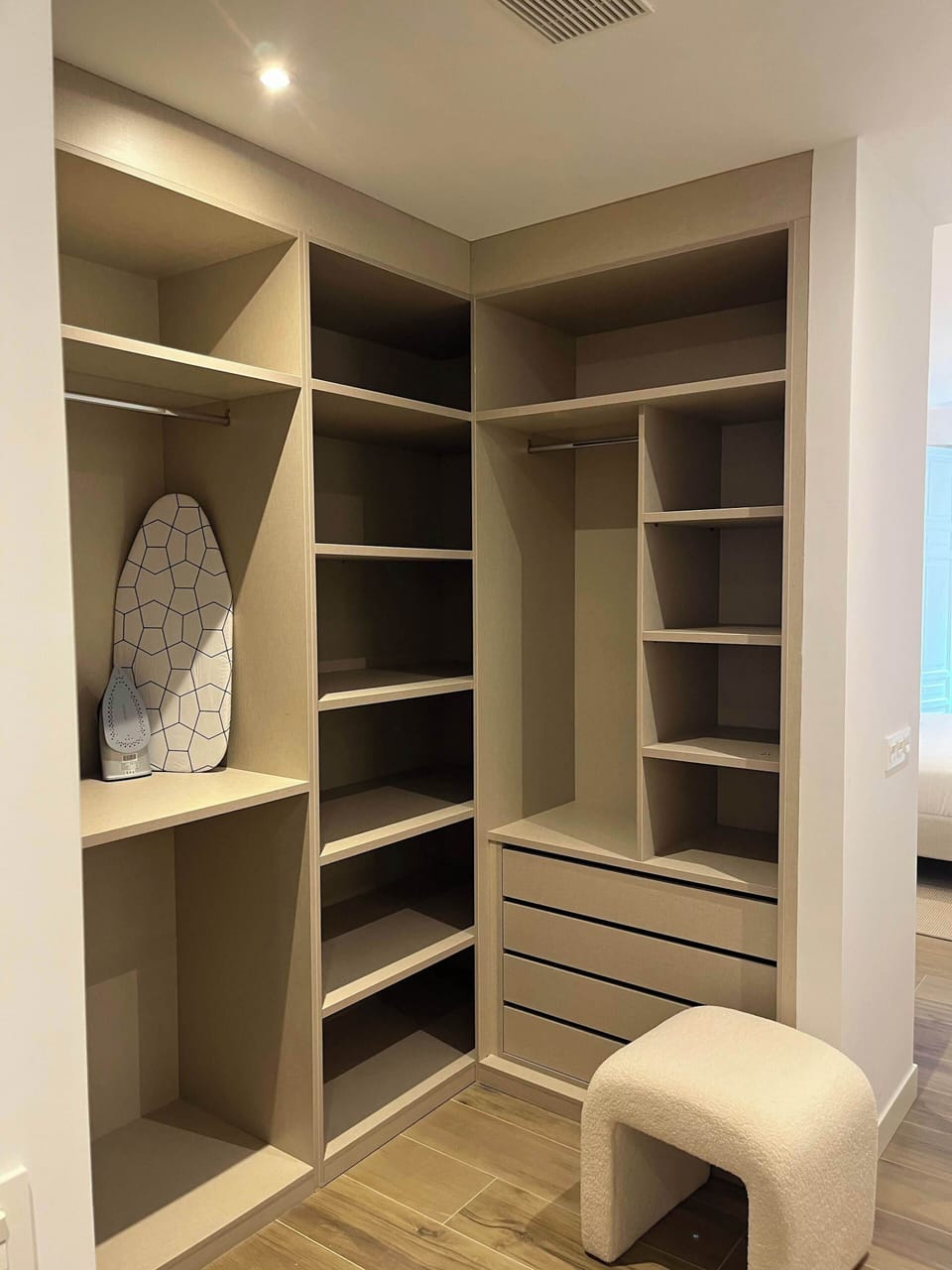 Corner walk-in closet and dressing area.