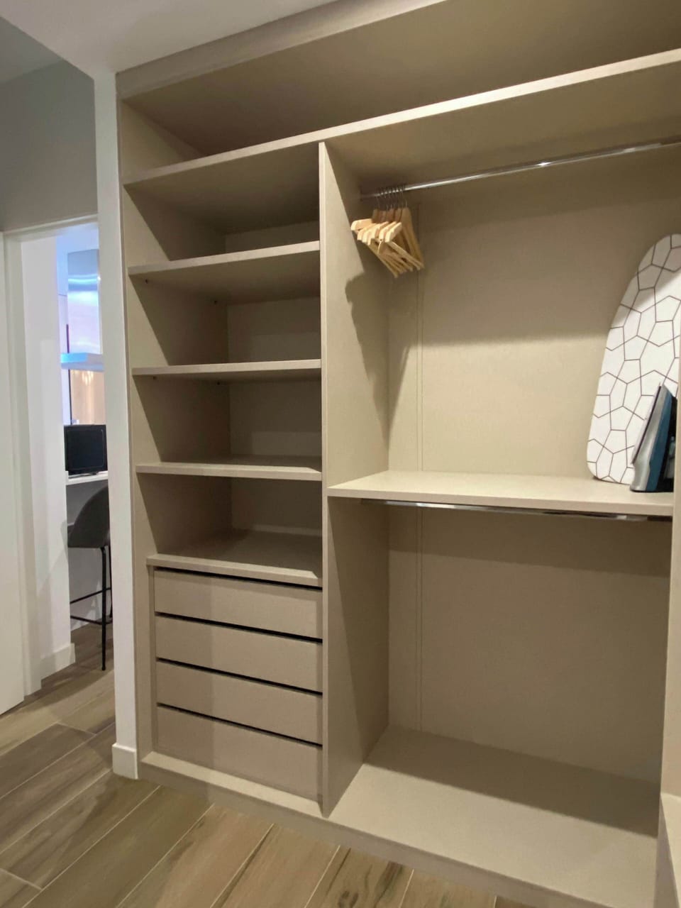 Walk-in closet with shelves and storage space.