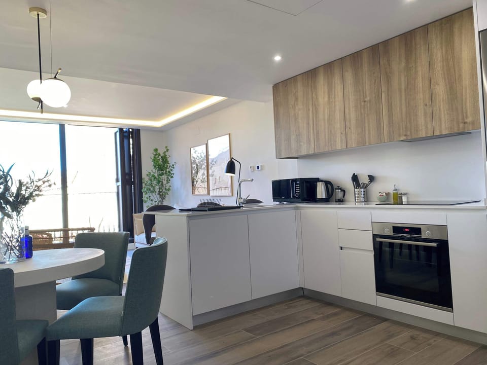 Modern kitchen and dining area.