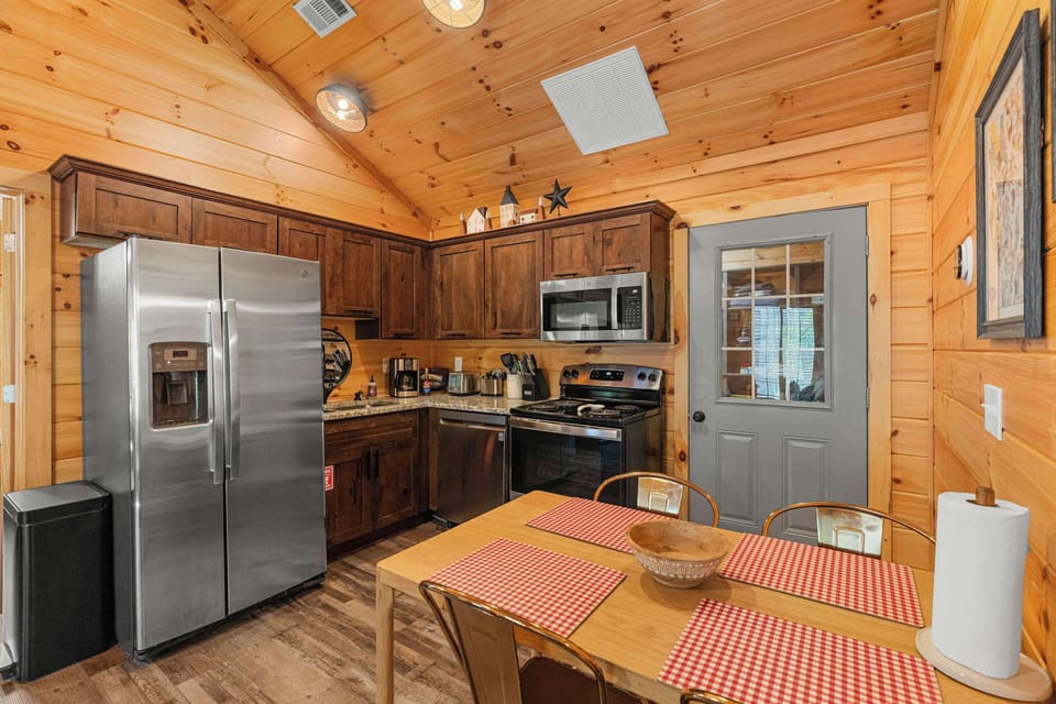 Whip up culinary delights in this charming kitchen with modern appliances and rustic charm!