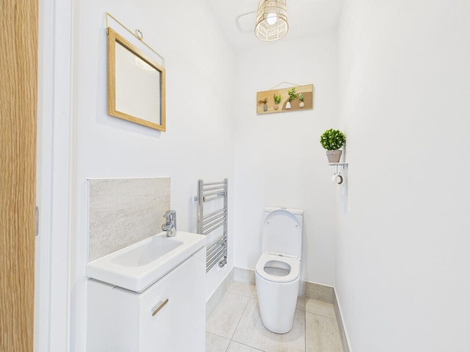 Sleek, clean bathroom fully equipped with modern amenities.