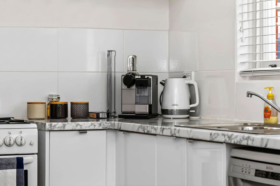 Cosy space featuring a handy coffee maker and portable heater for added comfort during your stay