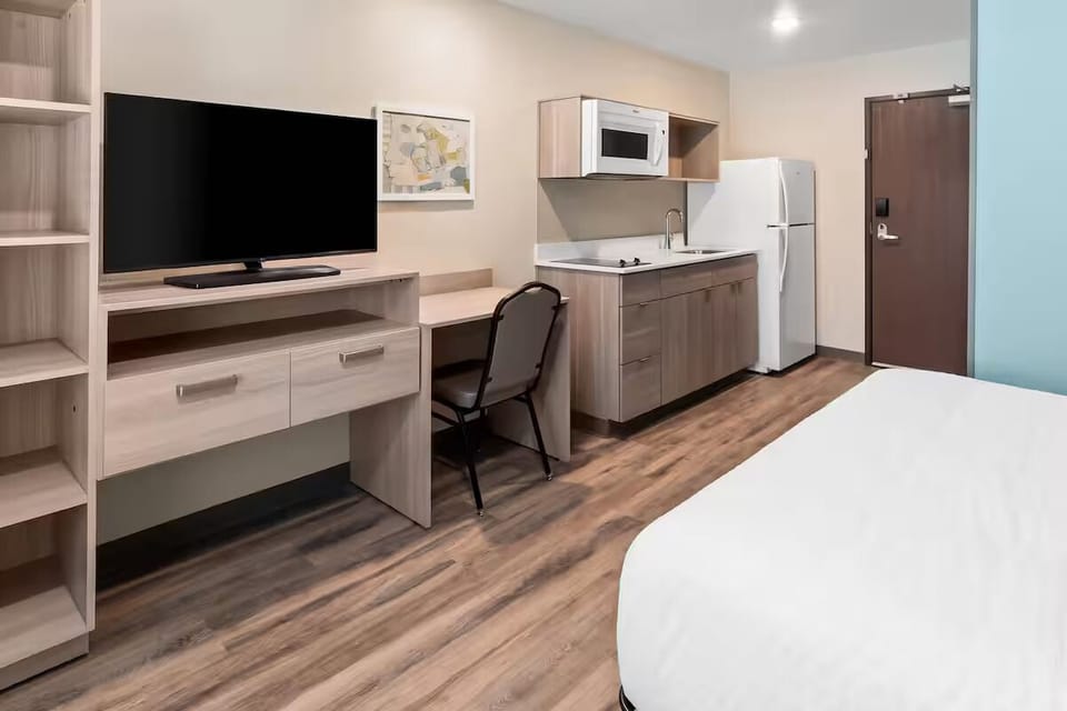 Settle in with a big TV and handy workspace.