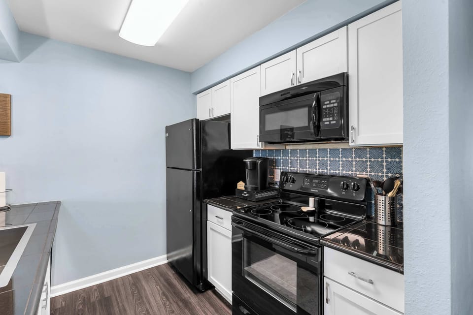 The open kitchen offers ample space & all the comforts of home​