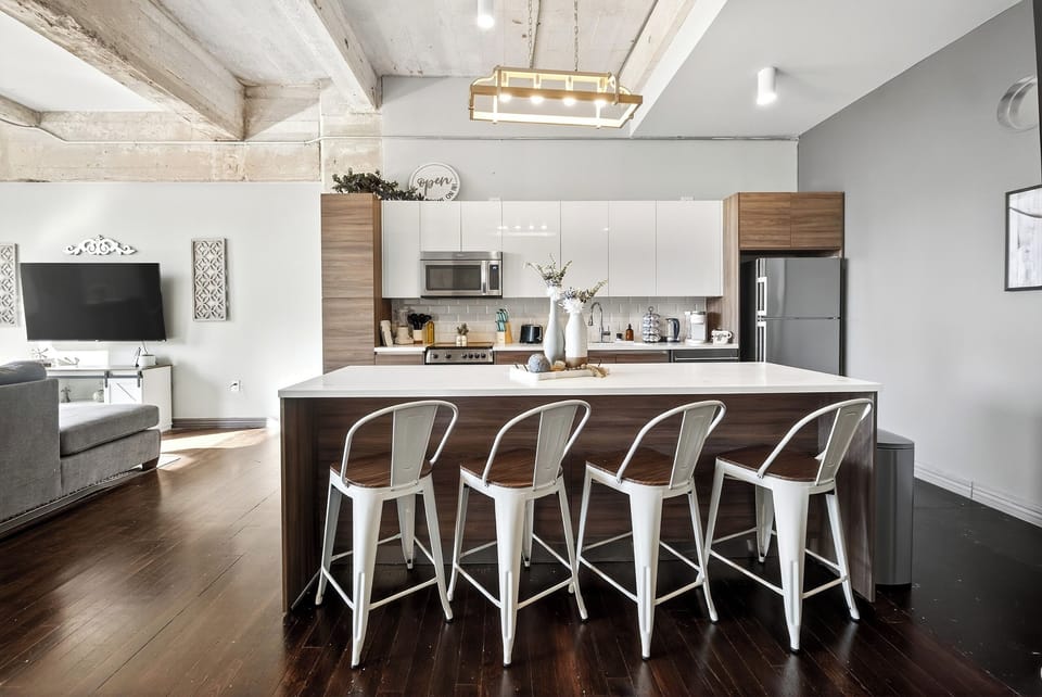 Full kitchen with modern appliances and island seating