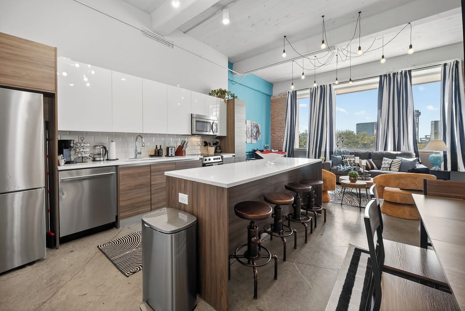 Full kitchen with modern appliances and island seating