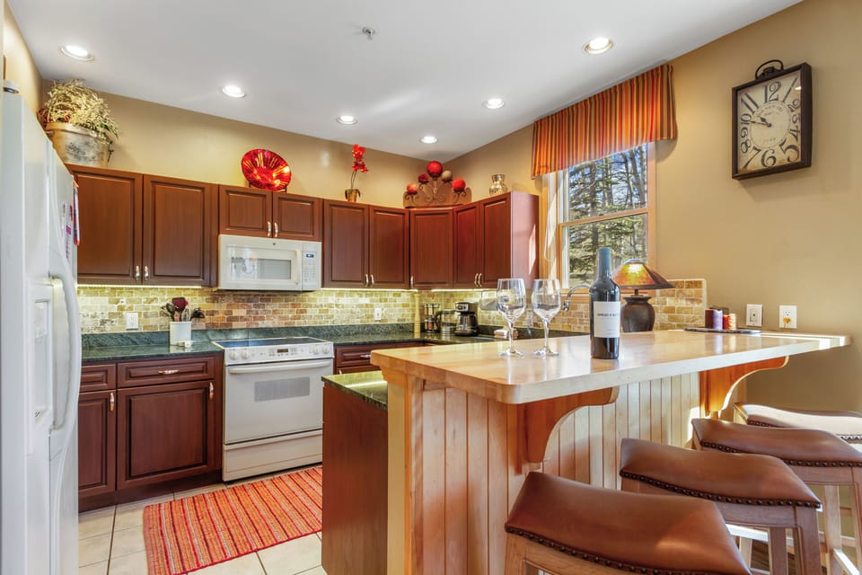 Full well stocked kitchen with whatever the chef may need and Breakfast Bar.