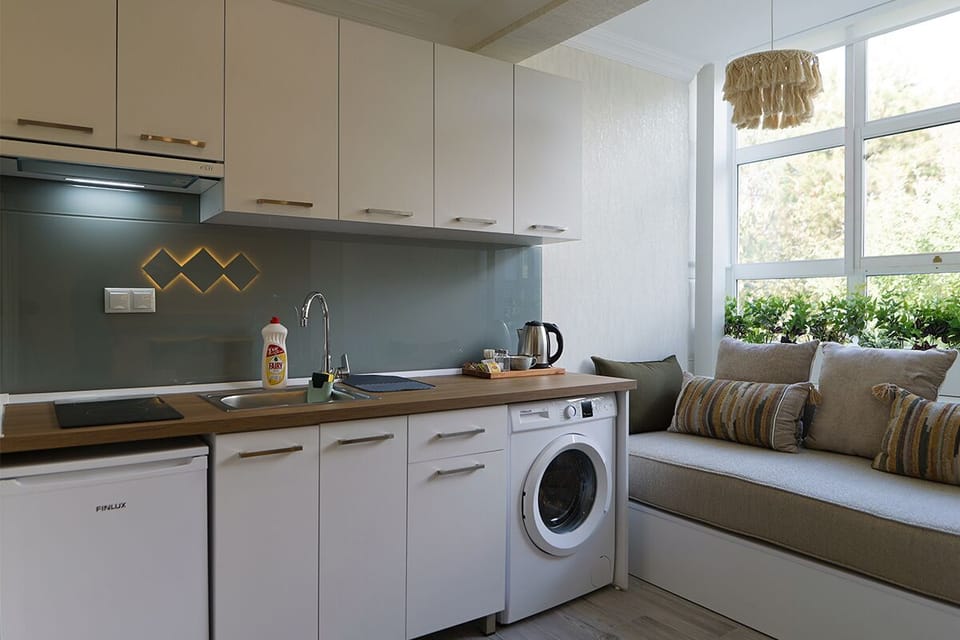 Mini-fridge, stovetop, cookware/dishes/utensils