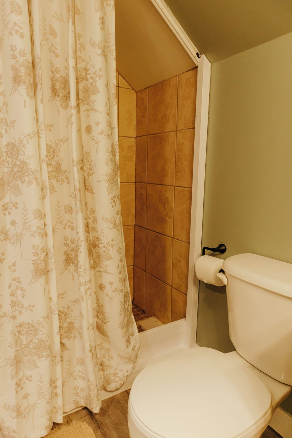 Modern walk-in shower with fresh towels and sleek, spa-like design.