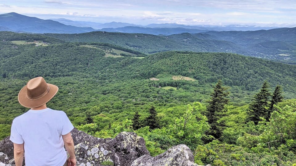 Explore the beauty of Pisgah National Forest with endless layers of Blue Ridge Mountain views and scenic overlooks throughout the region.