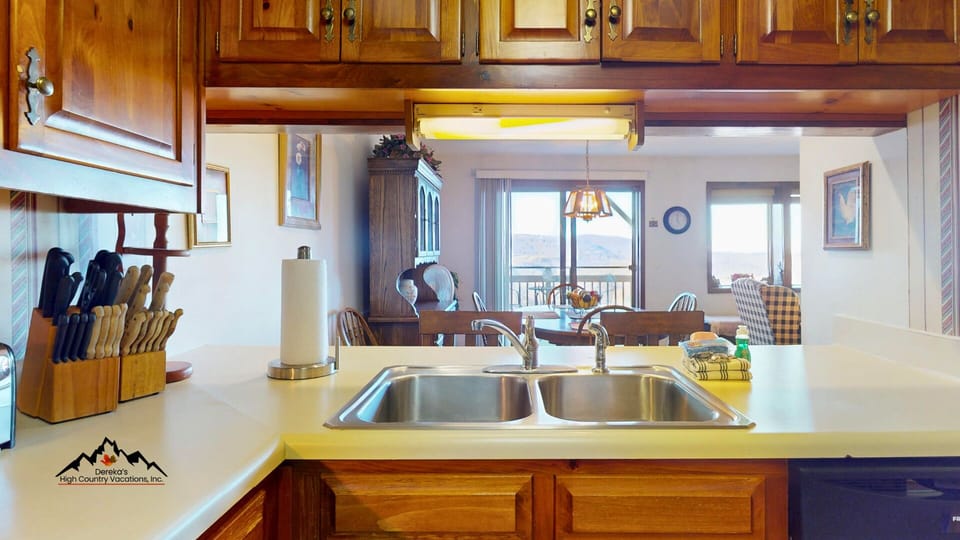 Kitchen with breakfast bar seating by the sink