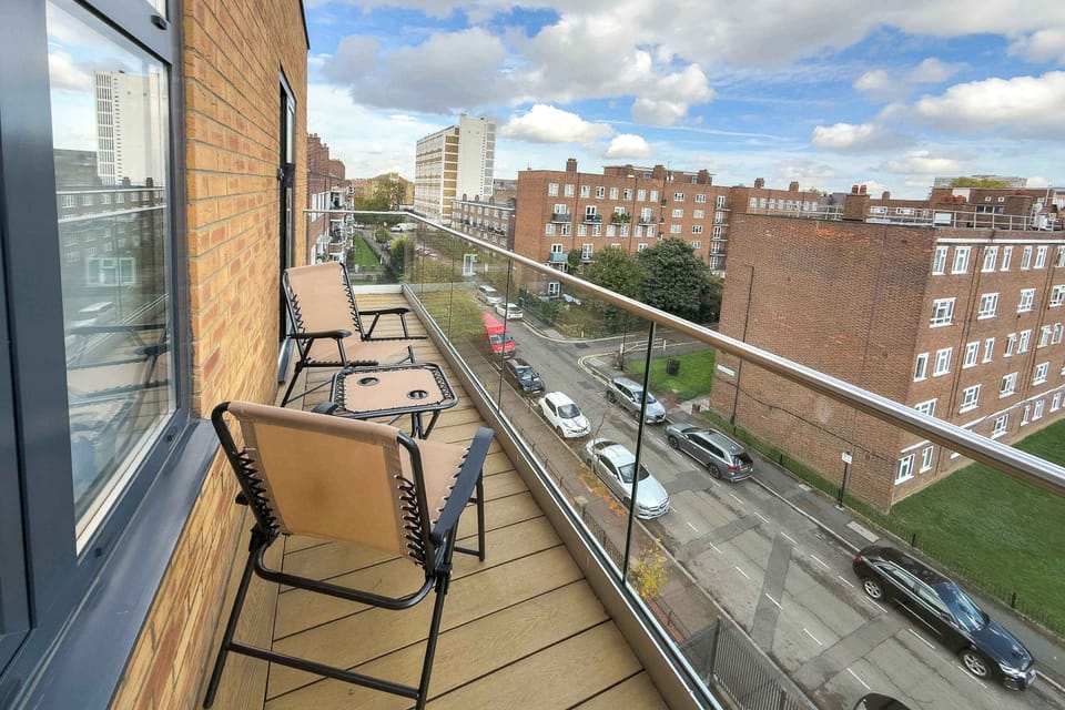 Private balcony with a comfortable seating area—the perfect spot to enjoy your morning coffee, evening drink or simply relax and take in the neighbourhood views