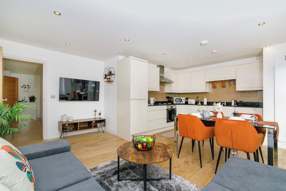 Stylish open-plan living, dining and kitchen area with direct access to the private balcony, creating the perfect space to relax, dine and enjoy quality time together