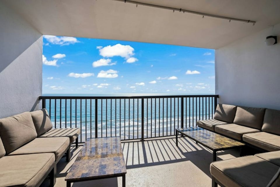 Enjoy the morning sun on this oceanfront balcony.