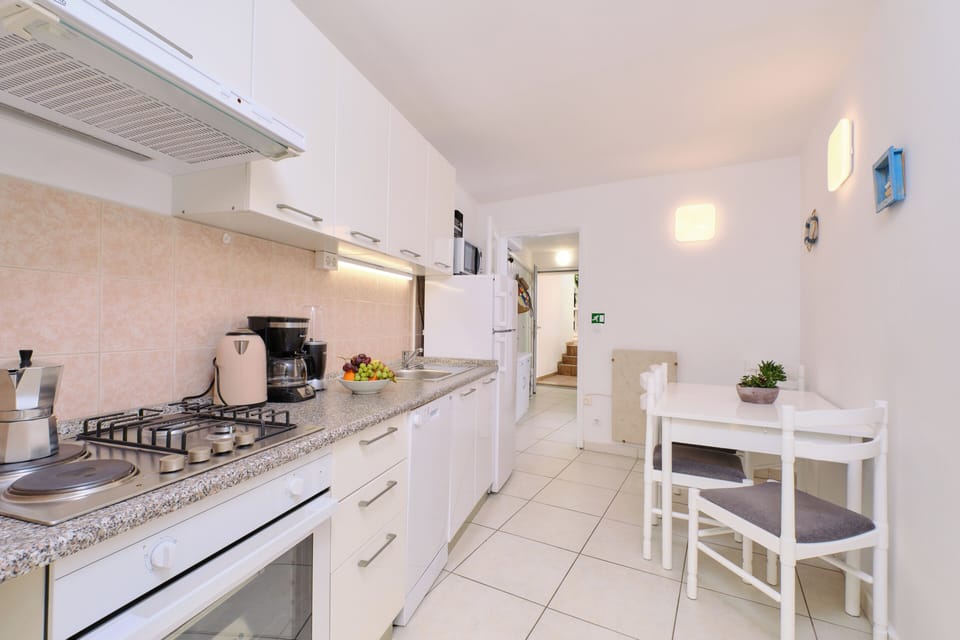 fully equipped kitchen-dishwasher, stove, microwave, fridge with freezer,blender