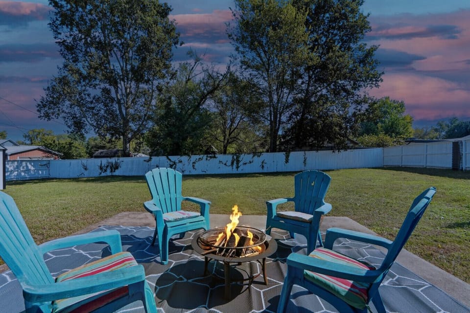 Firepit Area | Cozy Outdoor Seating with Blue Adirondack Chairs | Relax and Enjoy Evenings Under the Stars